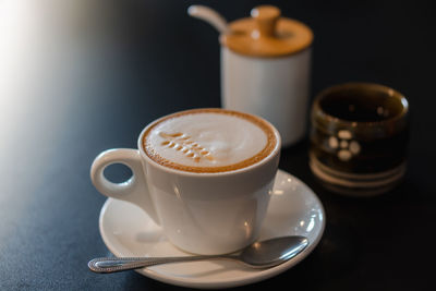 Close-up of coffee cup on table