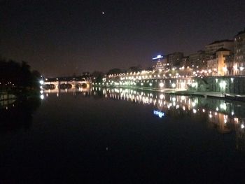 Reflection of illuminated buildings in water