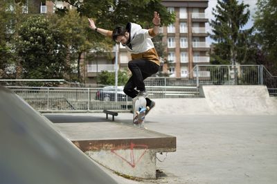 Full length of man skateboarding on skateboard