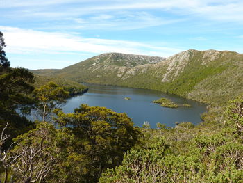 Scenic view of lake and mountains against sky