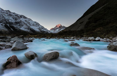 Surface level of lake against mountain range