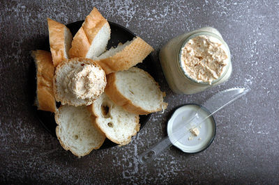 High angle view of bread and pate on table