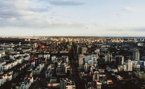 High angle view of modern buildings in city against sky