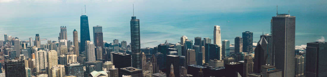 Panoramic view of modern buildings against sky