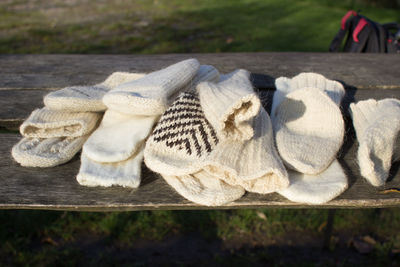 Close-up of gloves on wooden table at park