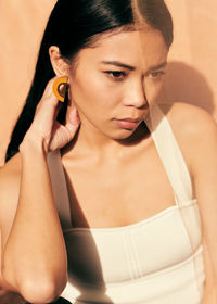 Close-up portrait of beautiful young asian woman with fabric props