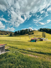Scenic view of agricultural field against sky