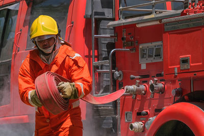 Rear view of man working in factory