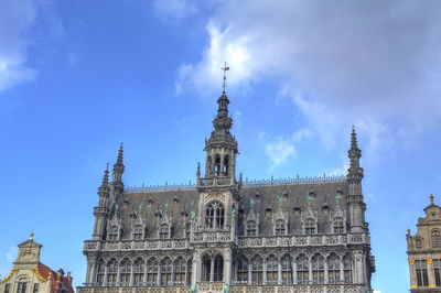 Low angle view of historical building against blue sky