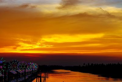 Scenic view of sea against orange sky