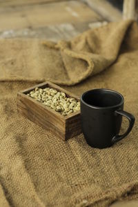 Close-up of coffee cup on table