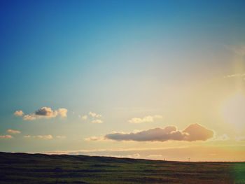 Scenic view of landscape against sky at dusk