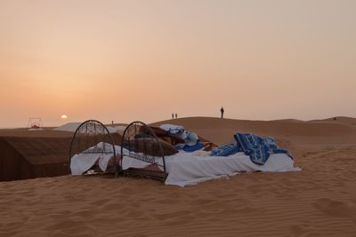 Scenic view of beach against sky during sunset