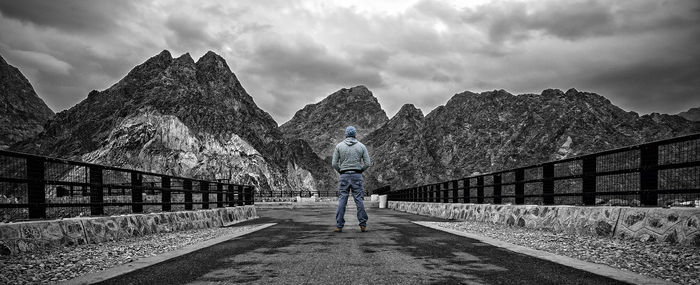 Rear view of man walking on water