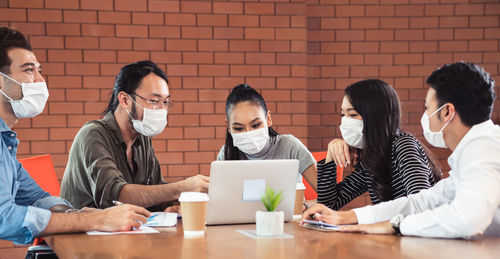 Group of people using laptop