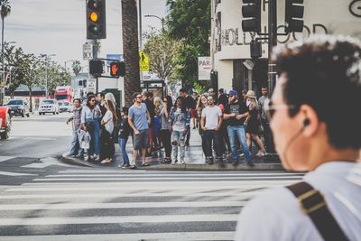 People walking on road in city