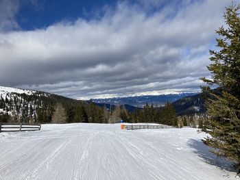 Scenic view of snow covered mountains against sky