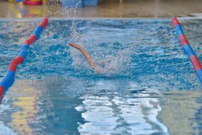 Close-up of person swimming in pool