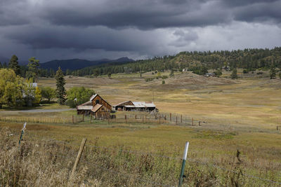 Storm clouds gathering over a ranch in colorado