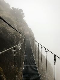 View of suspension bridge in foggy weather