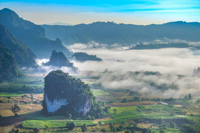 Scenic view of landscape and mountains against sky