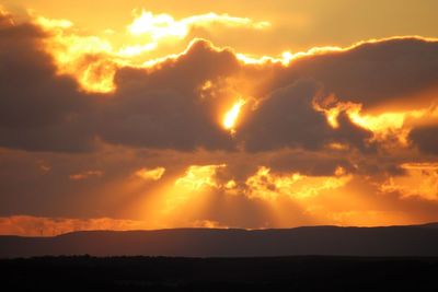 Scenic view of dramatic sky during sunset