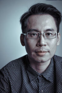 Portrait of man wearing eyeglasses