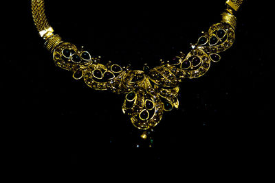 Close-up of lighting equipment against black background