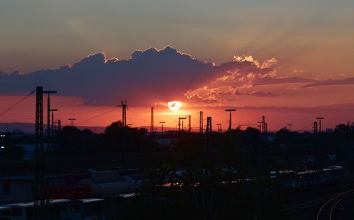 Silhouette landscape against sky during sunset