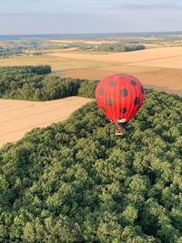 View of hot air balloon flying over land