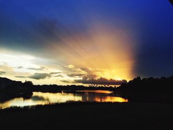 Scenic view of lake at sunset