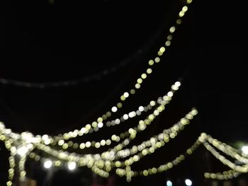 Close-up of illuminated christmas lights at night