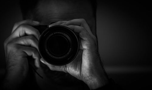 Close-up of person holding camera