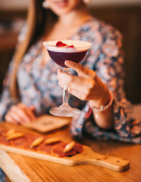 Midsection of woman holding ice cream