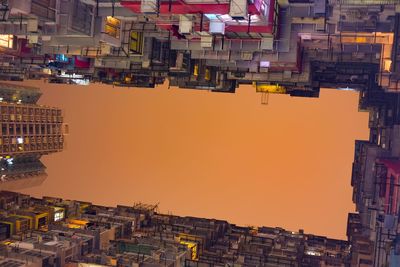 High angle view of buildings against sky during sunset