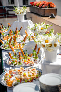 High angle view of appetizer served in plate on table at garden party