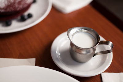 High angle view of coffee cup on table