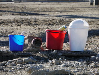 Close-up of drinking glasses on beach
