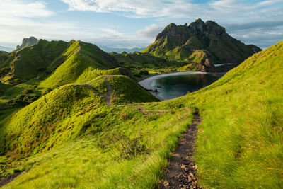 Scenic view of landscape and mountains against sky