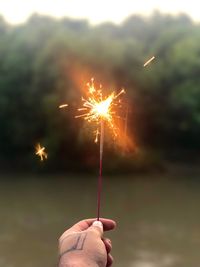 Low angle view of firework display at night