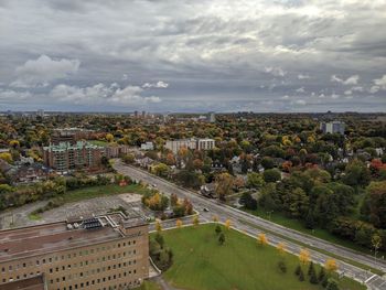 High angle view of buildings in city against sky