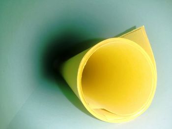 Close-up of rolled up yellow paper