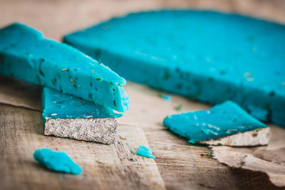 Close-up of blue paint on table