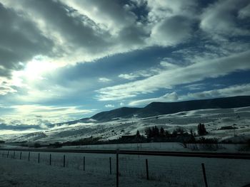 Scenic view of mountains against sky during winter