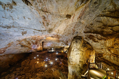 Low angle view of illuminated cave