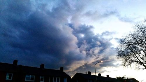 High section of building against cloudy sky