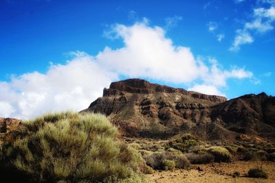 Scenic view of arid landscape against sky