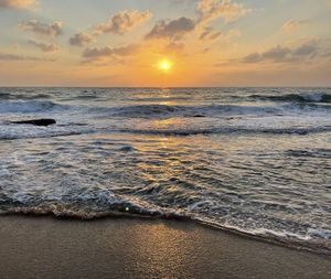 Scenic view of sea against sky during sunset