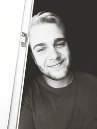 Close-up portrait of a smiling young man