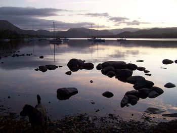Scenic view of sea against sky at sunset